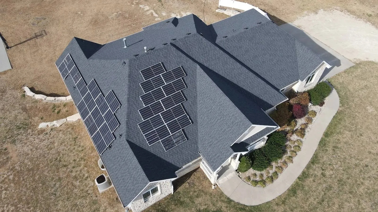 Restored Victorian home with a new charcoal shingle roof in Abilene, Kansas