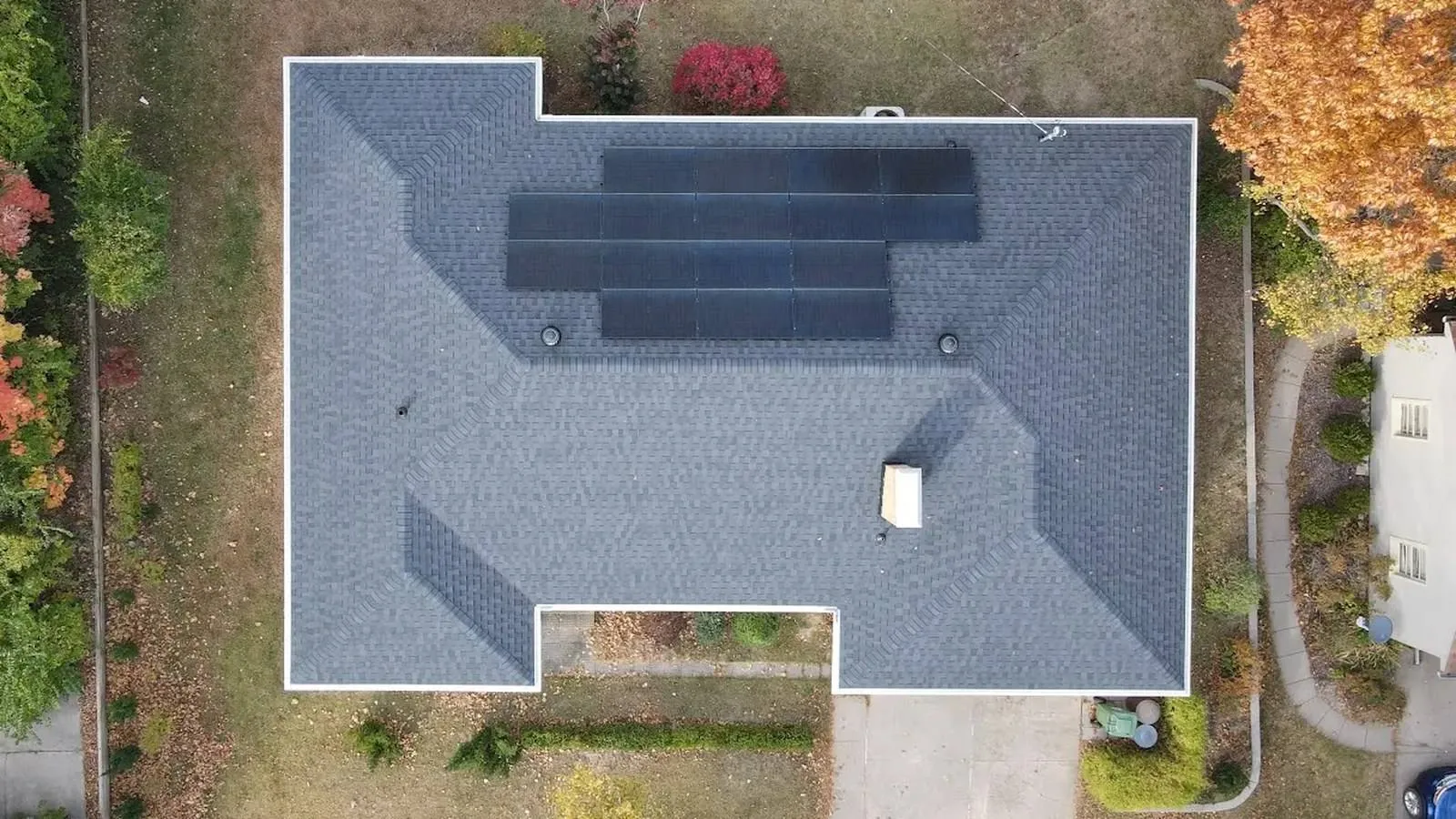 Direct overhead view of a Basehor, Kansas home with a new shingle roof and rooftop solar panels
