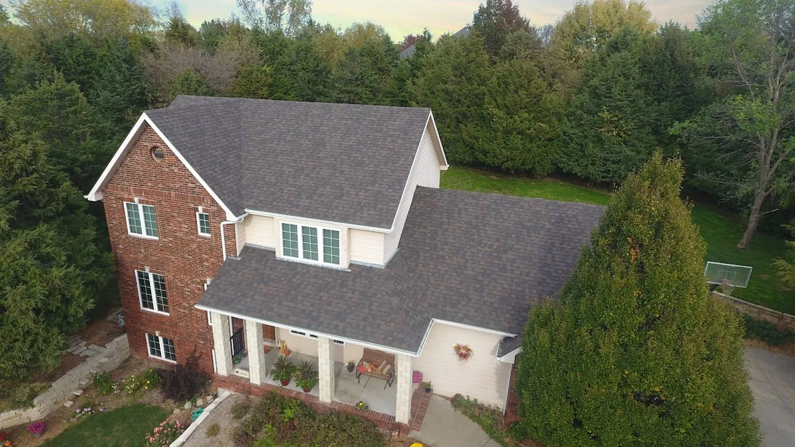 La Vista, Nebraska brick two story home with a new architectural shingle roof and front porch