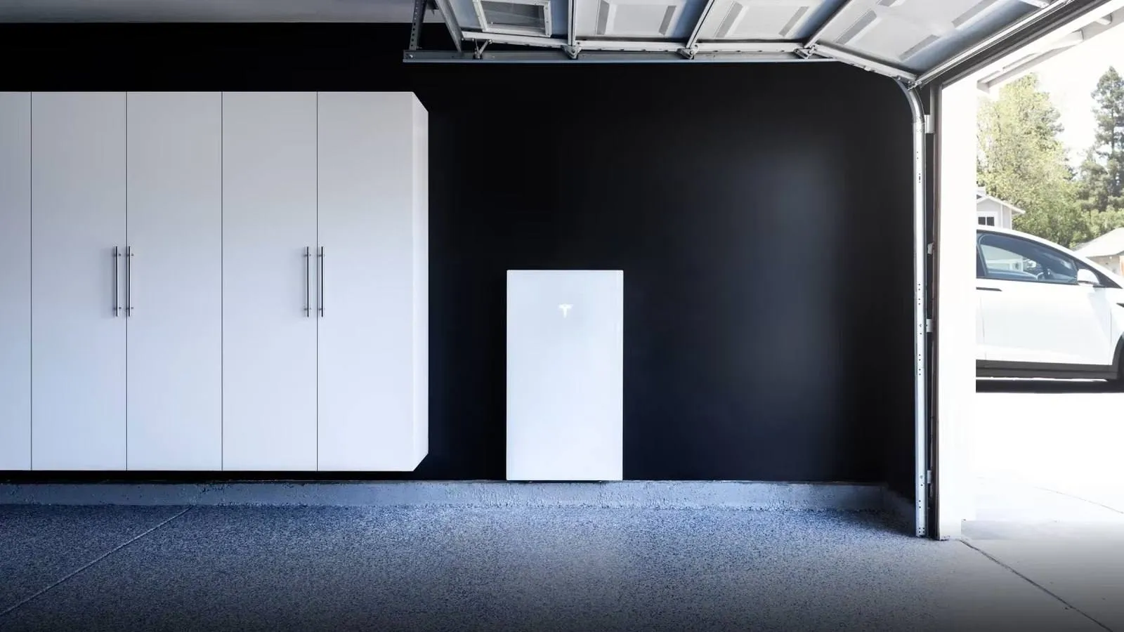 Tesla Powerwall home battery mounted on a garage wall, serving Louisville, Colorado
