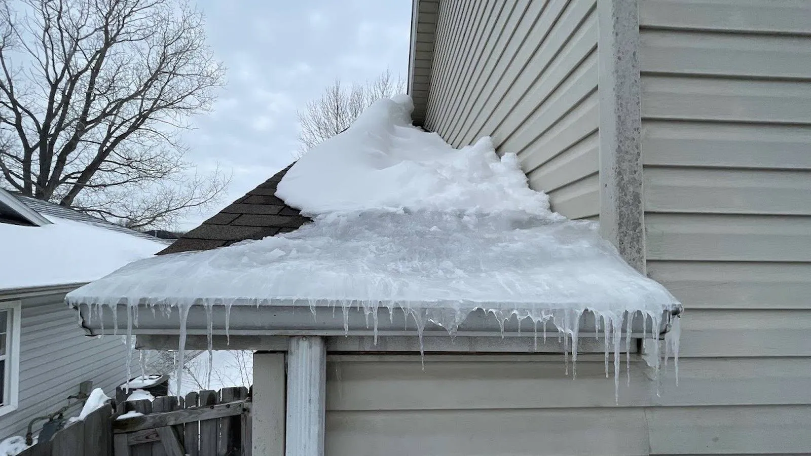 Ice buildup and icicles hanging from a gutter on a home near Lyons, Colorado after a winter storm