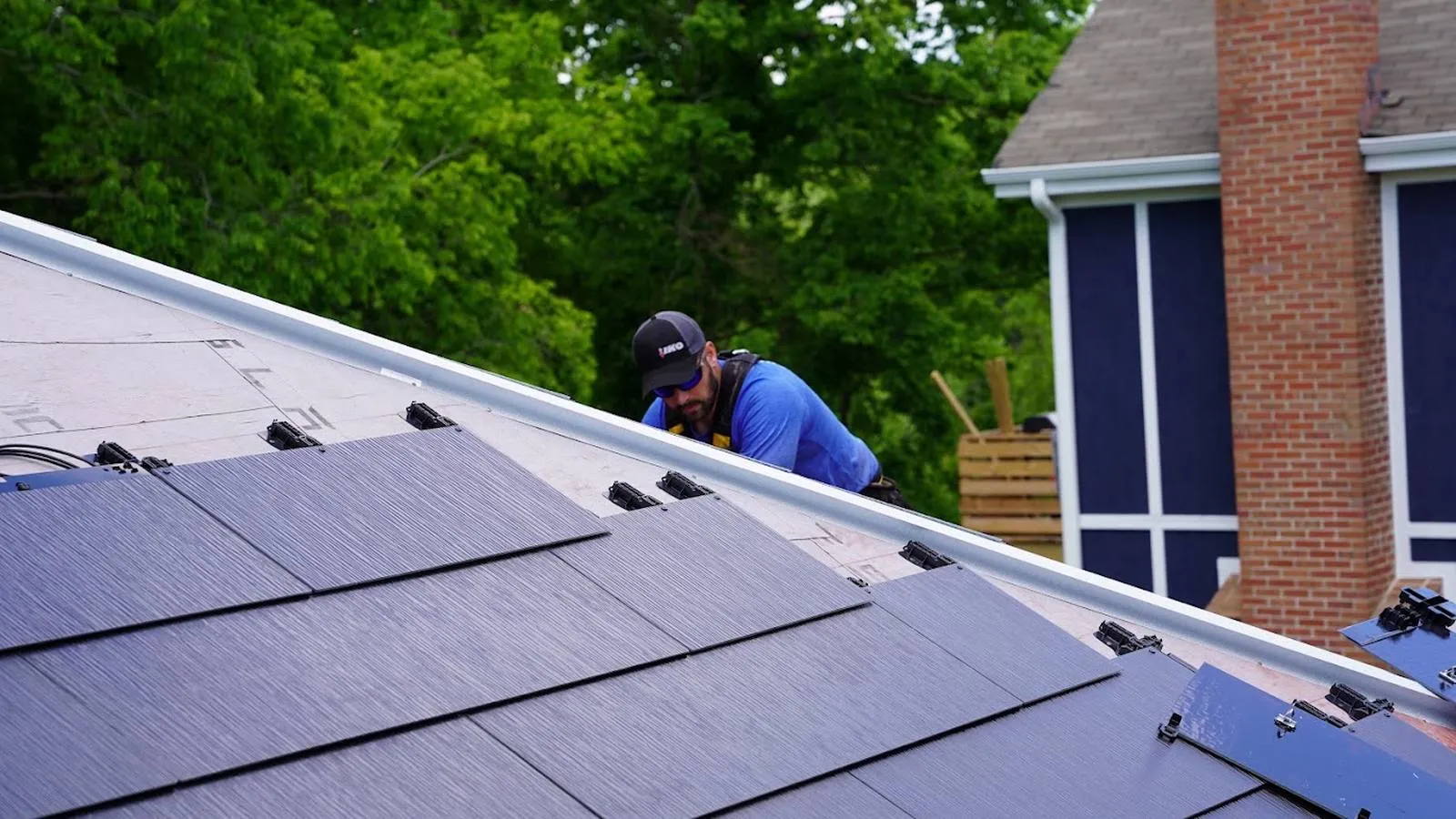 Weddle and Sons roofer installing solar roof tiles on a Thornton, Colorado area home