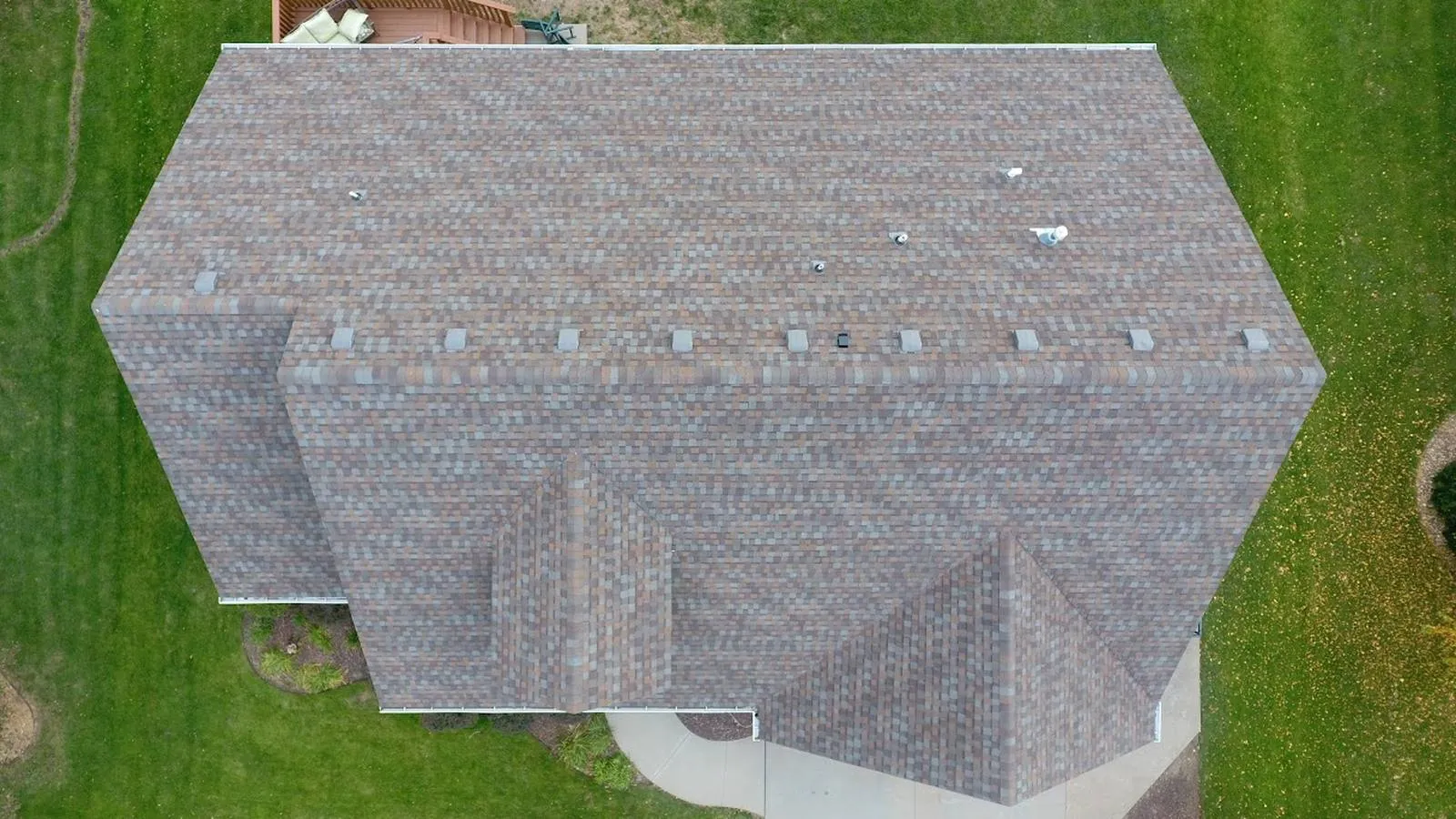 Overhead view of a Waverly, Nebraska home with a new multi tone architectural shingle roof and green lawn