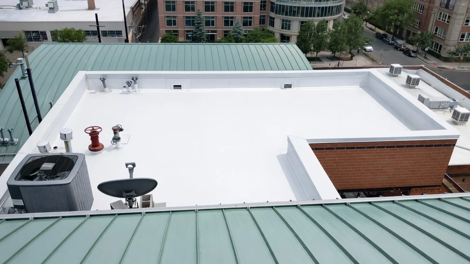Commercial building with a new flat TPO roofing system