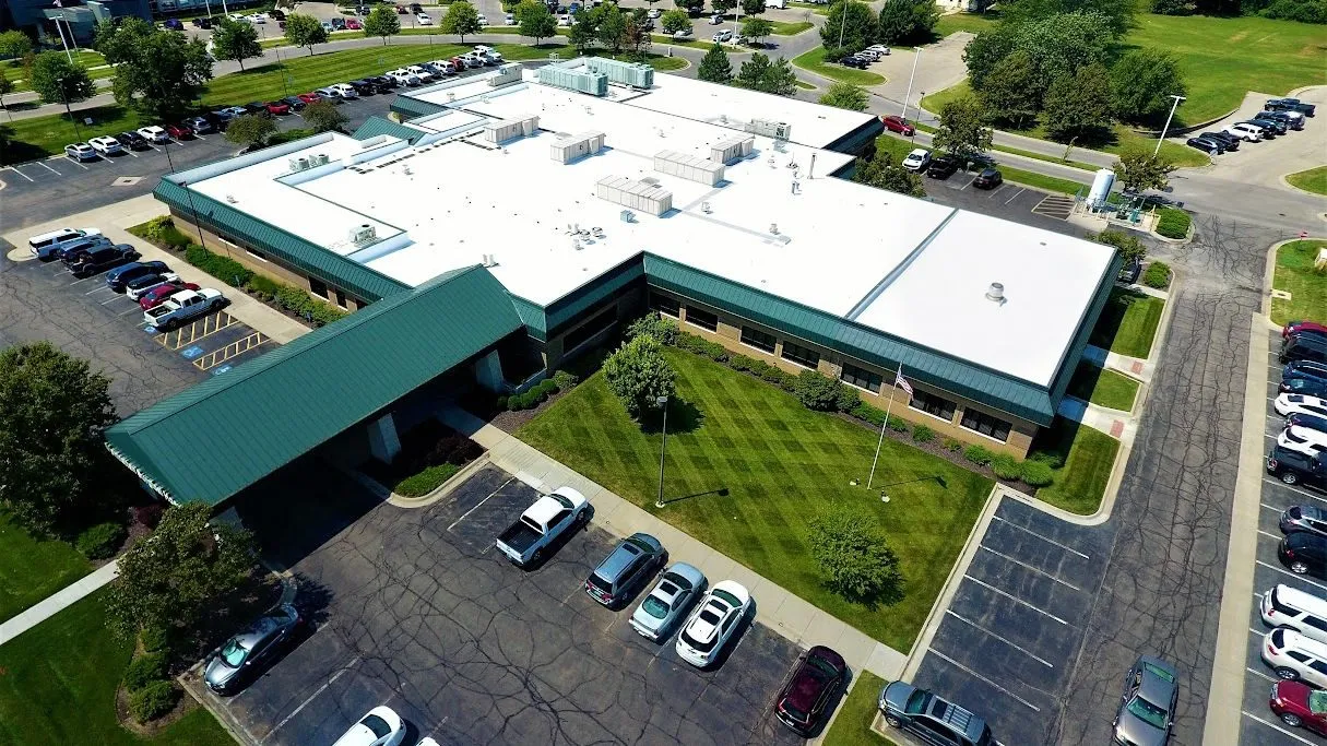 Commercial building with a new flat TPO roofing system