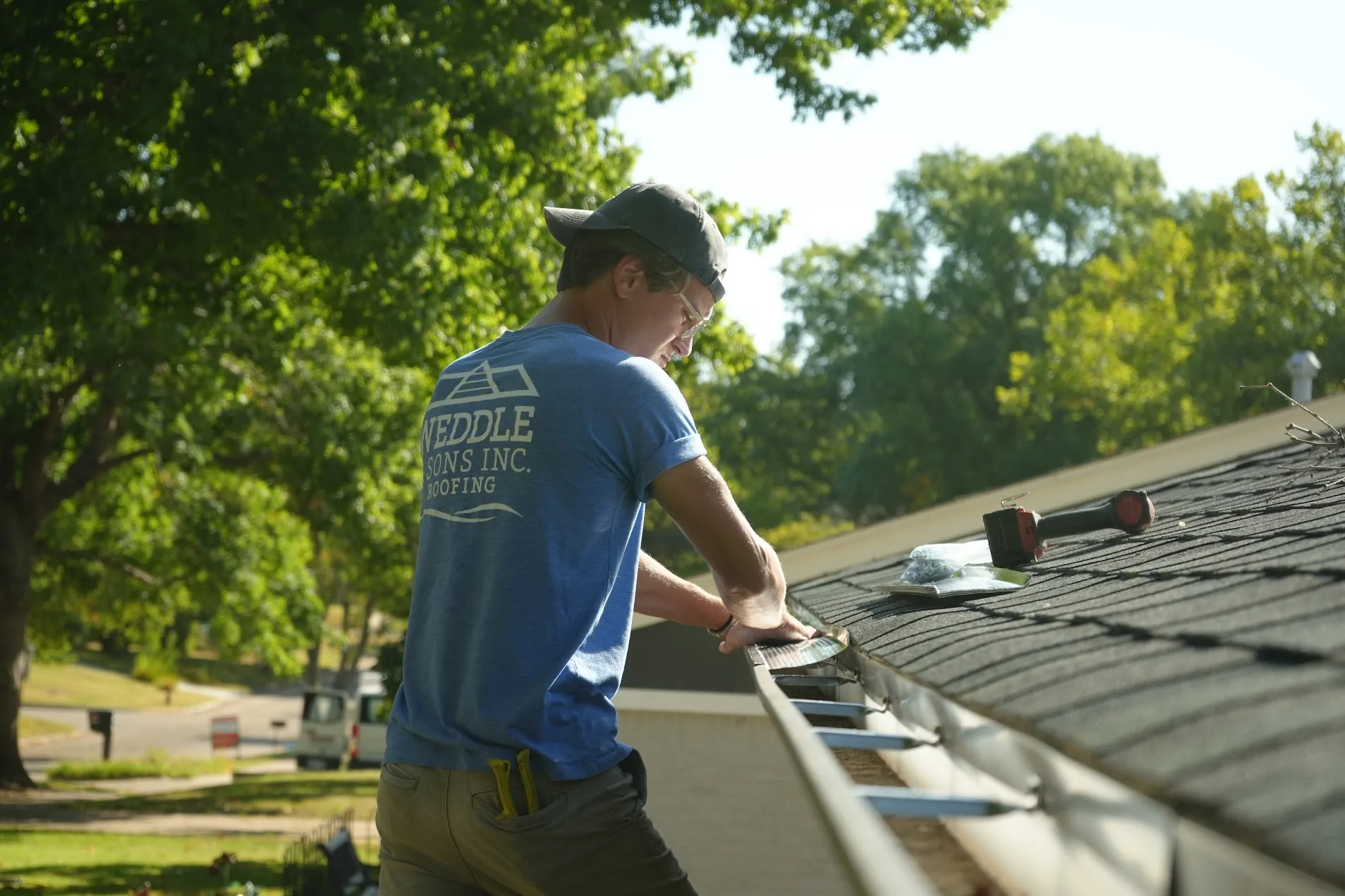 Seamless gutter and downspout installed on the corner of a house
